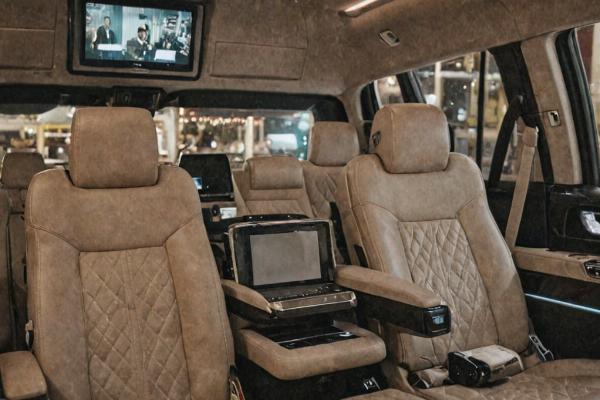 Luxury SUV interior with captain chairs and entertainment system